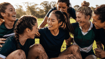 Women rugby players celebrating on the pitch - Rugby Terms Every Beginner Should Know