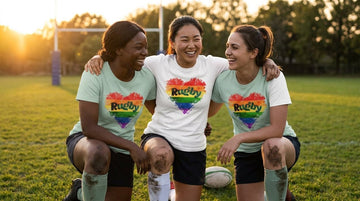 Women teammates celebrating in Pride Love rugby shirts for women on the pitch