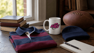 College rugby fanwear flat lay with striped polo mug beanie and rugby ball