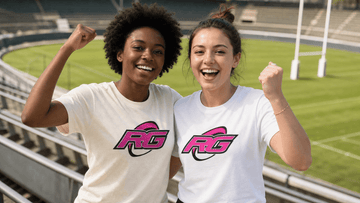 Two women supporters in rugby shirts cheering together in empty stadium bleachers