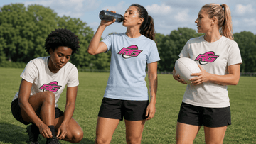 Women rugby players in practice outfits taking a hydration break on outdoor pitch