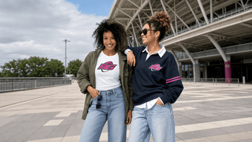Two women rugby supporters outside modern stadium wearing stylish women's rugby supporter style outfits for game day