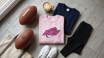 Flat lay of essential women's rugby season wardrobe staples including sweatshirt tee and ball