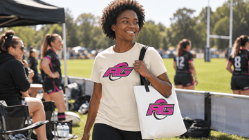 Woman wearing women's rugby tee with tote at sunny sideline