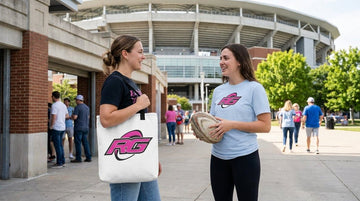 Women outside stadium comparing rugby merch tote versus fanwear on match day