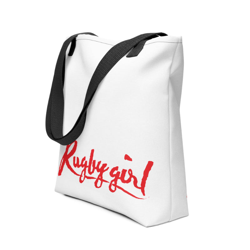 White tote bag with bold red "Rugby girl" script, black shoulder straps, women's rugby apparel ideal for rugby gifts and fans. - Rugby Girl