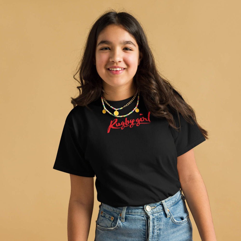 Girl's black rugby t shirt with bold red "Rugby Girl" script, styled for casual wear. - Rugby Girl
