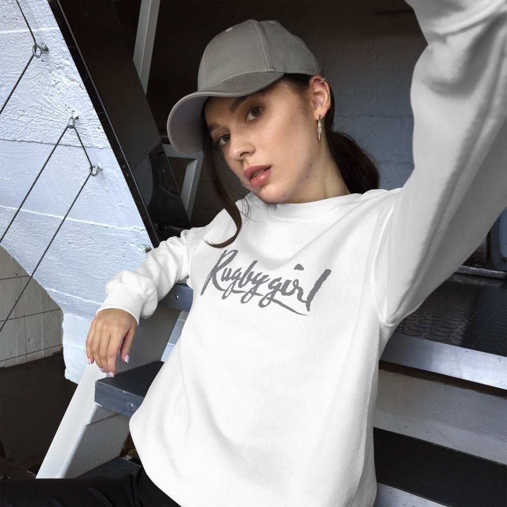 White women's rugby sweatshirt with bold "Rugby Girl" script, casual rugby apparel style. - Rugby Girl