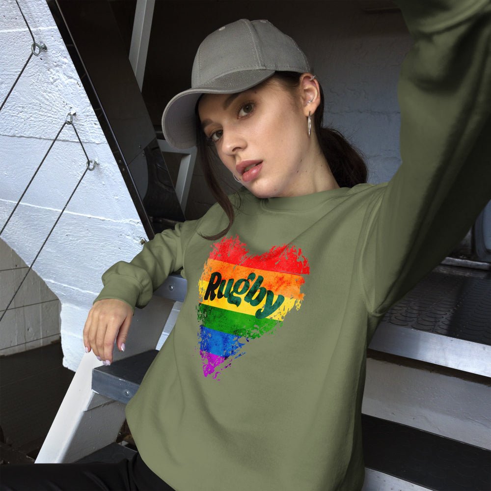 Military green women's rugby sweatshirt with rainbow heart and bold "Rugby" text design. - Rugby Girl