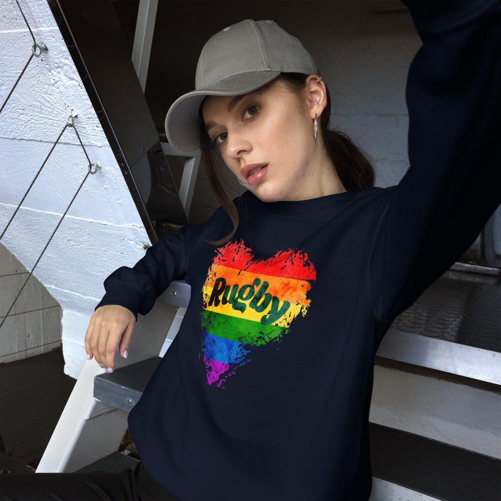 Navy women's rugby sweatshirt with rainbow heart and bold "Rugby" text, casual rugby apparel. - Rugby Girl