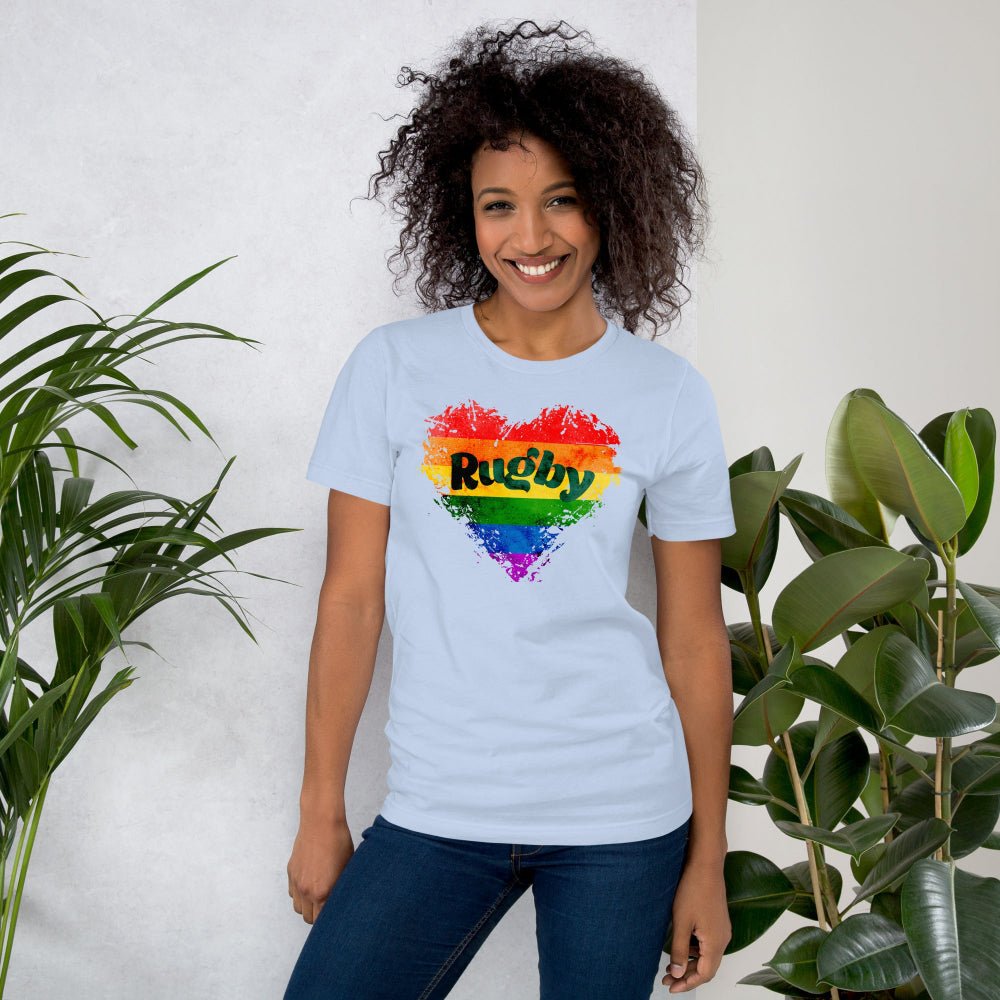 Light blue women's rugby t-shirt with colorful rainbow heart and bold "Rugby" text, casual rugby apparel. - Rugby Girl