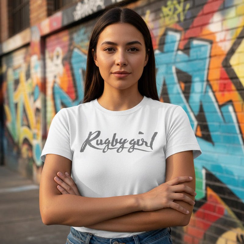 White women's rugby t-shirt with bold "Rugby Girl" script, casual fit for rugby fans and players. - Rugby Girl