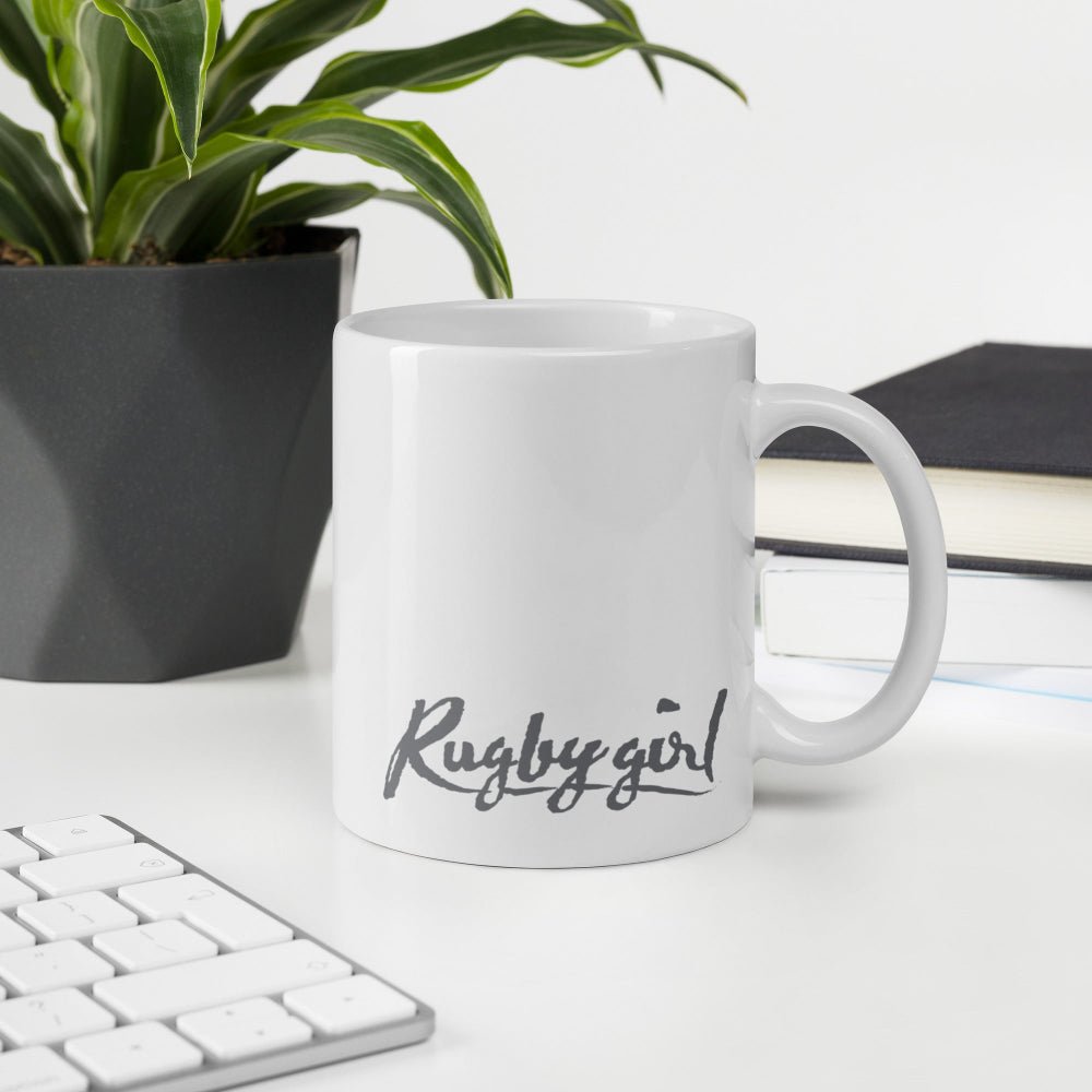 White ceramic mug with grey "Rugby girl" script, ideal rugby gift for women's rugby apparel fans. - Rugby Girl