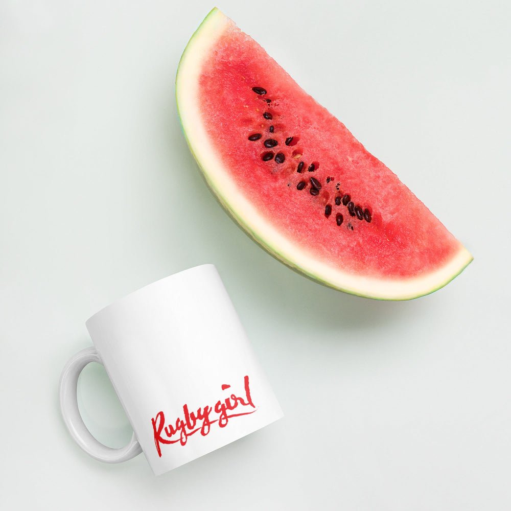White ceramic mug with bold red "Rugby girl" script, perfect rugby gift for women's rugby apparel fans. - Rugby Girl