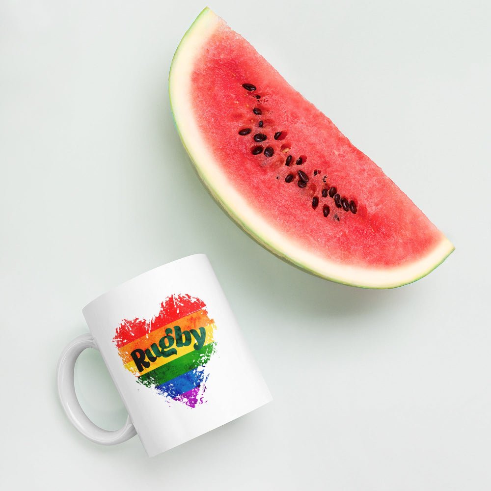 White ceramic mug with rainbow heart and "Rugby" text, ideal rugby gift for rugby girls and fans. - Rugby Girl