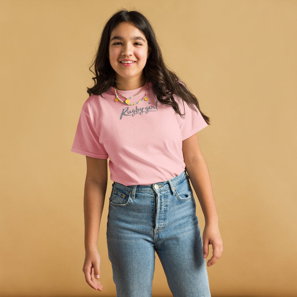 Light pink girl's rugby t-shirt with "Rugby Girl" script, casual fit for rugby fans and players. - Rugby Girl