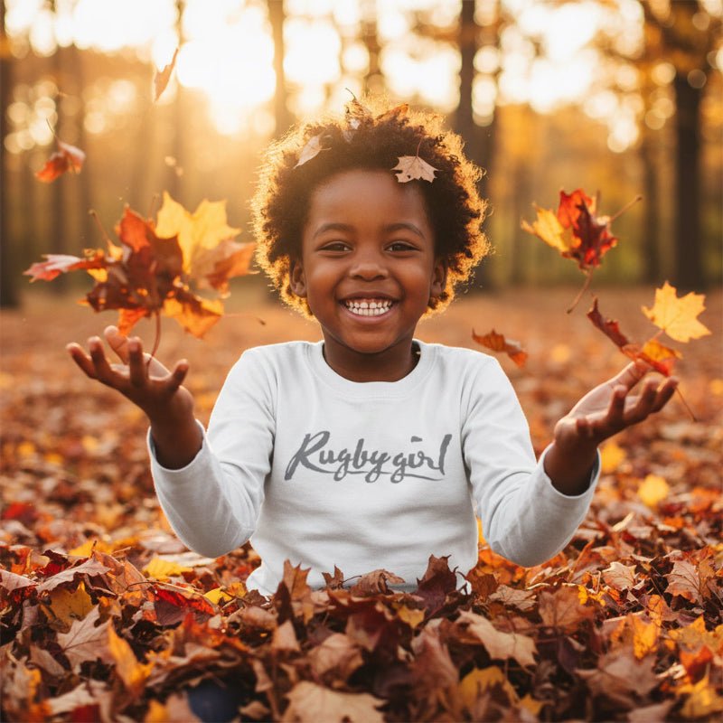 White long sleeve kids tee with bold "Rugby girl" script, women's rugby apparel style for rugby fans and families. - Rugby Girl